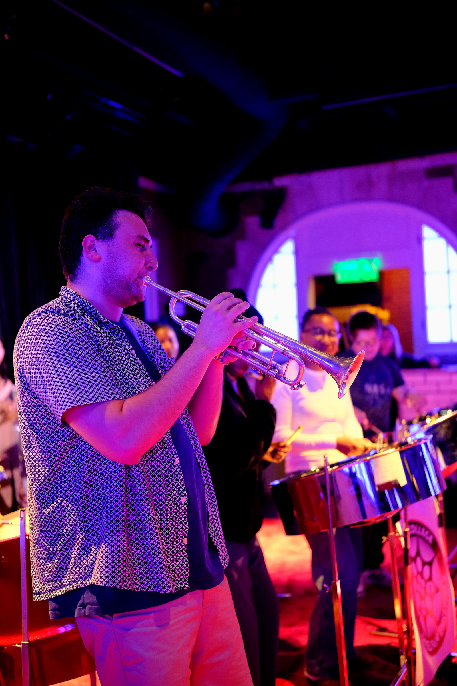 A trumpet player rehearsing with the steelpan ensemble.